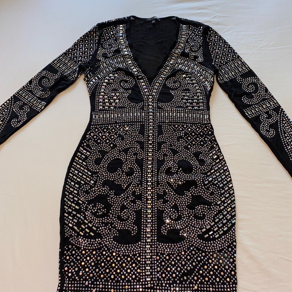 Sheer black sequence dress.